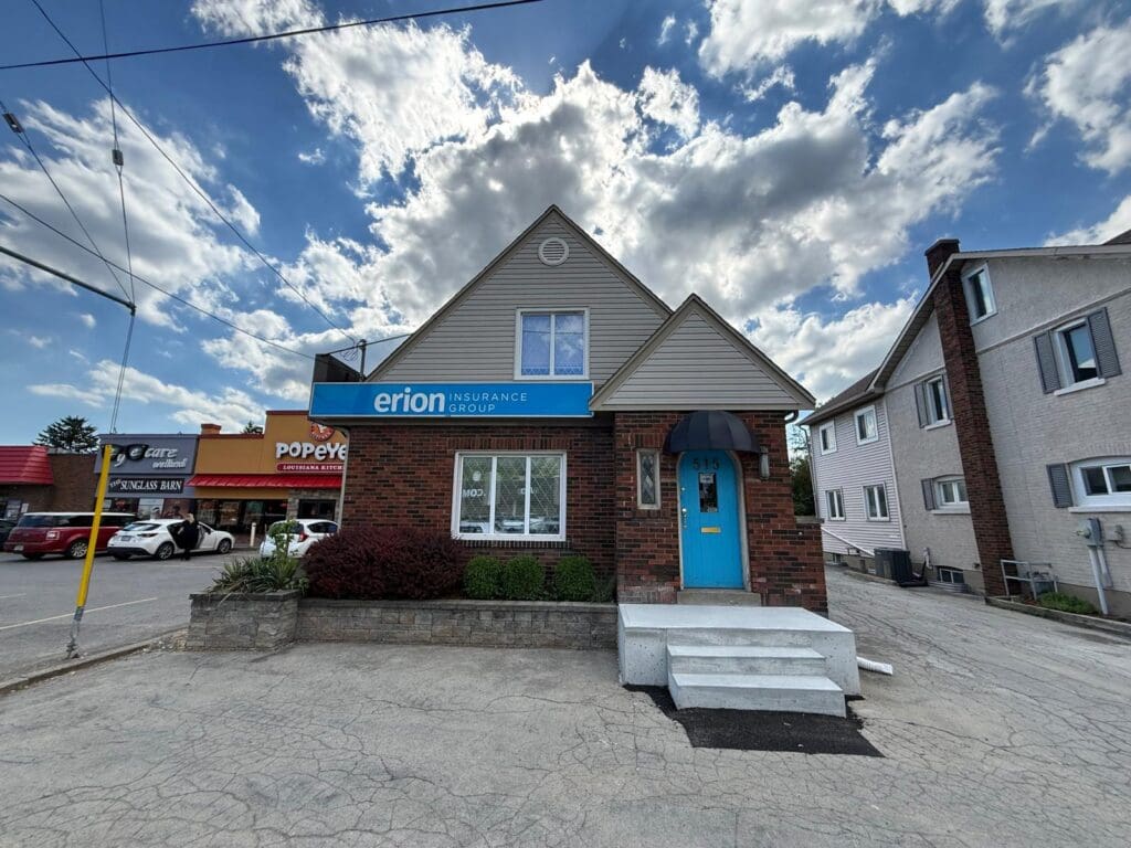 Brick building with blue door and sign